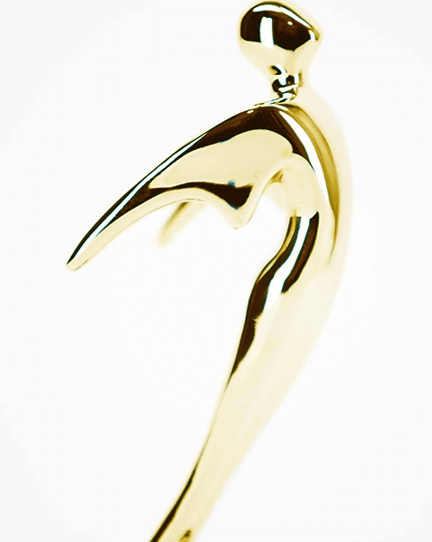 gold telly award statuette against white background