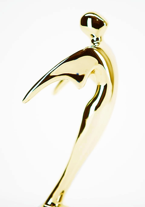 gold telly award statuette against white background