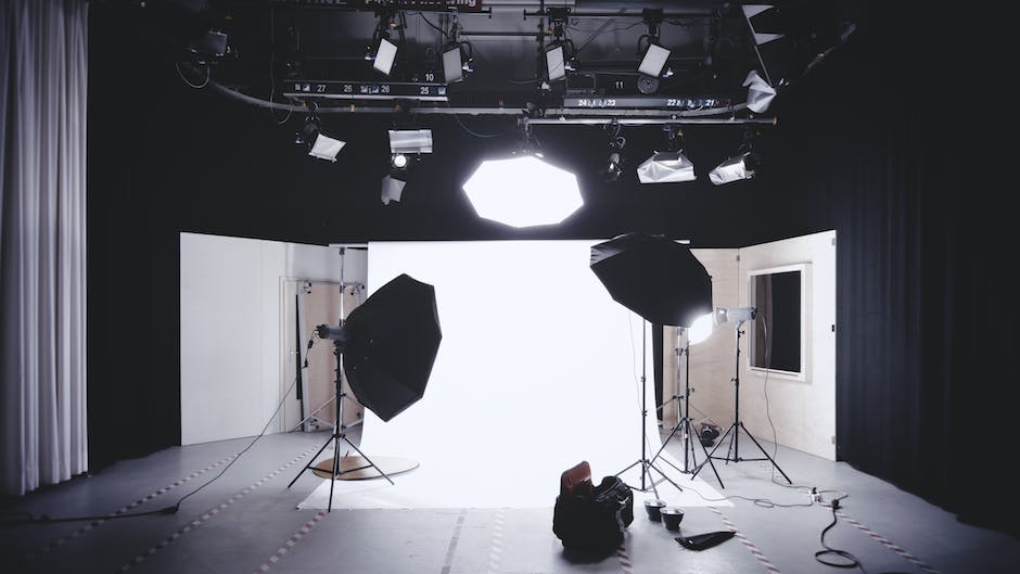 in the studio, on the set of a corporate photography project with lights set-up and no crew