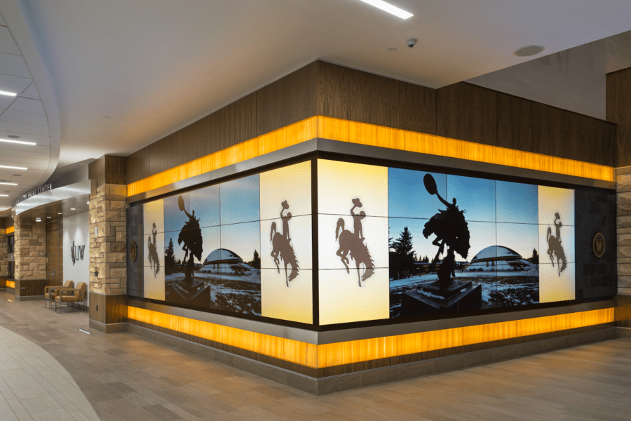 large video wall inside a mall showing a cowboy