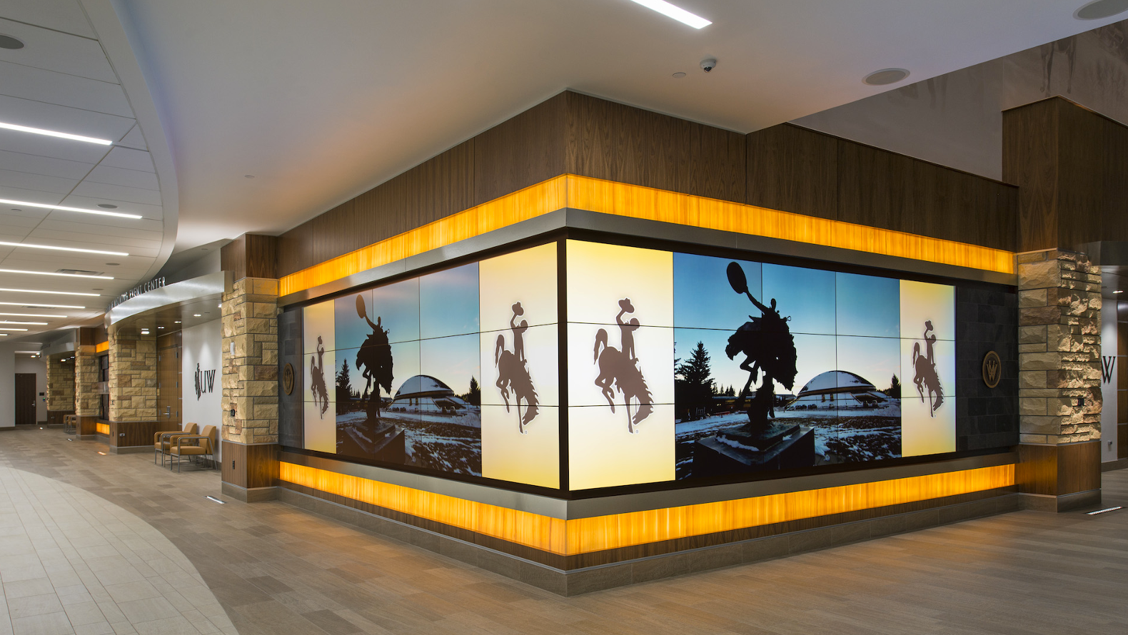 large video wall inside a mall showing a cowboy