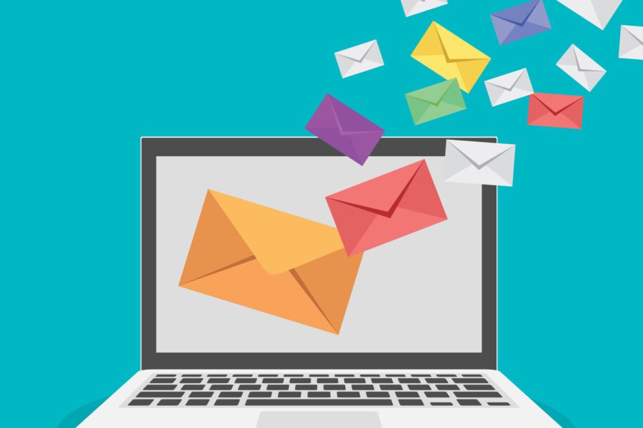 graphic of a laptop against blue with letters flying out of the screen