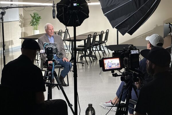 Corporate video production interview being filmed in a professional studio