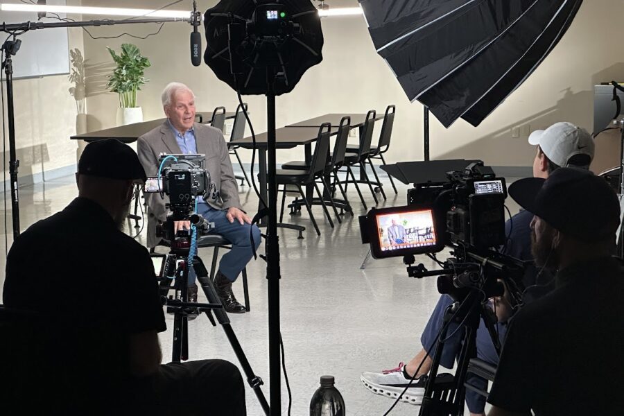 Corporate video production interview being filmed in a professional studio