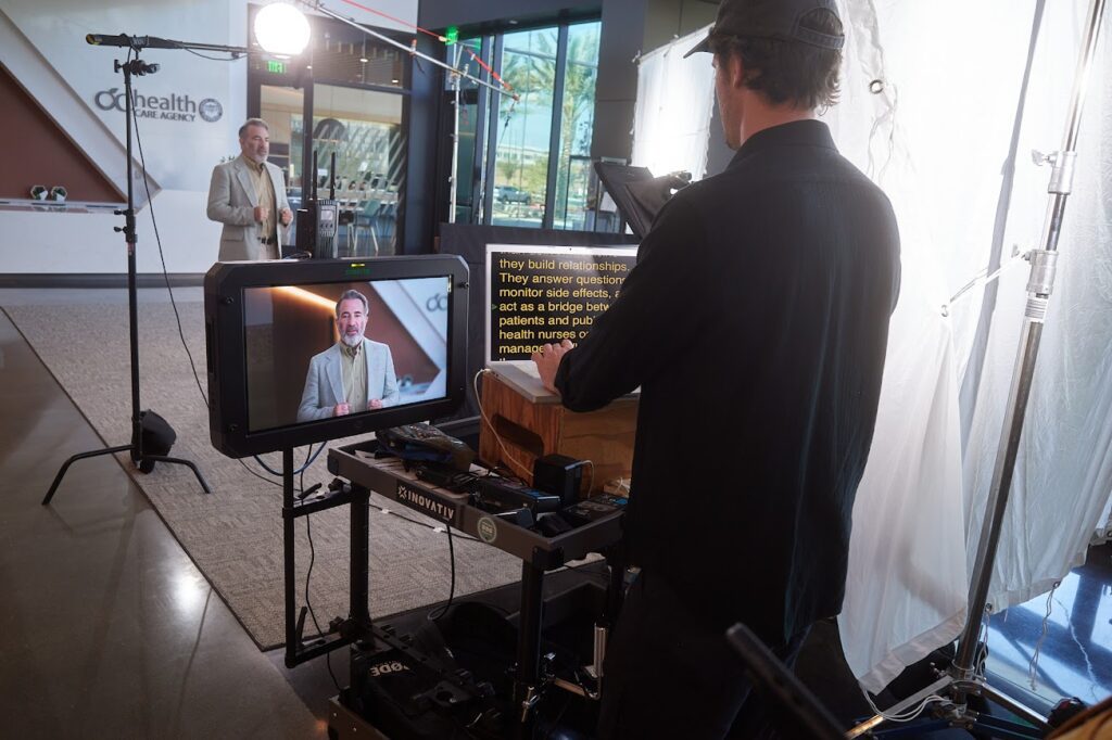 Professional spokesperson being filmed during a corporate video production