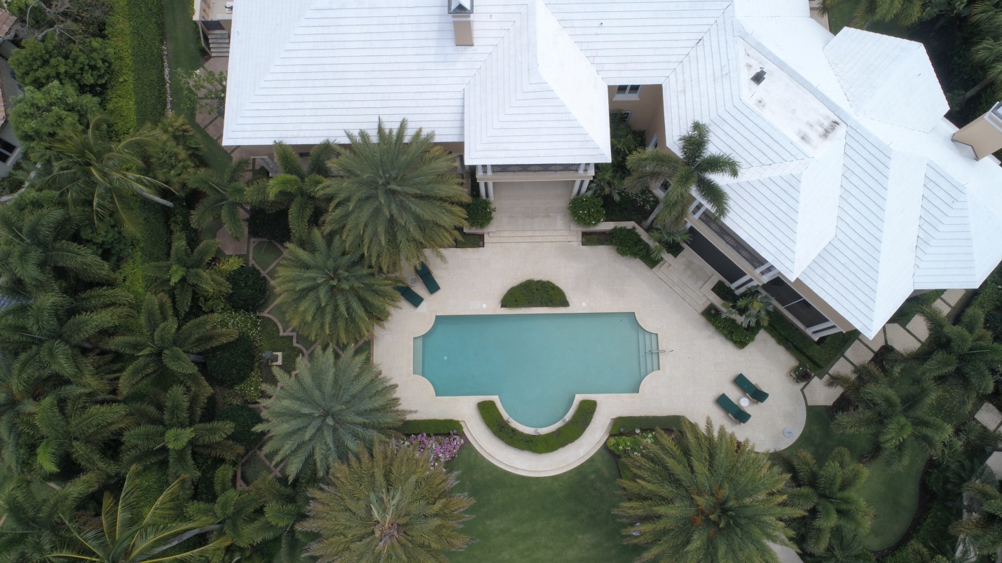 n aerial view of a house captured by a drone camera