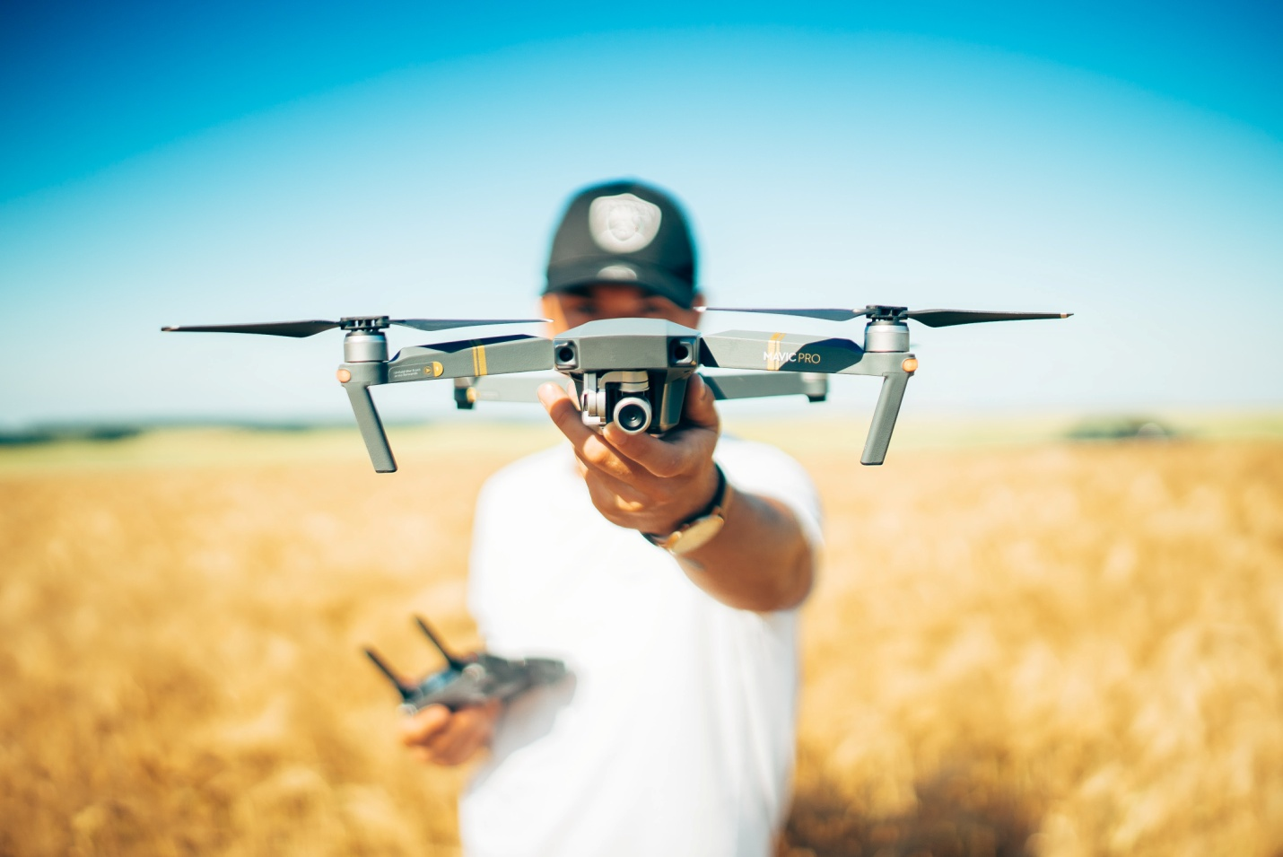 A cameraman holding a camera drone