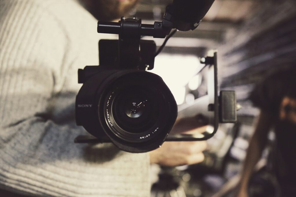 Person carrying a professional video recorder