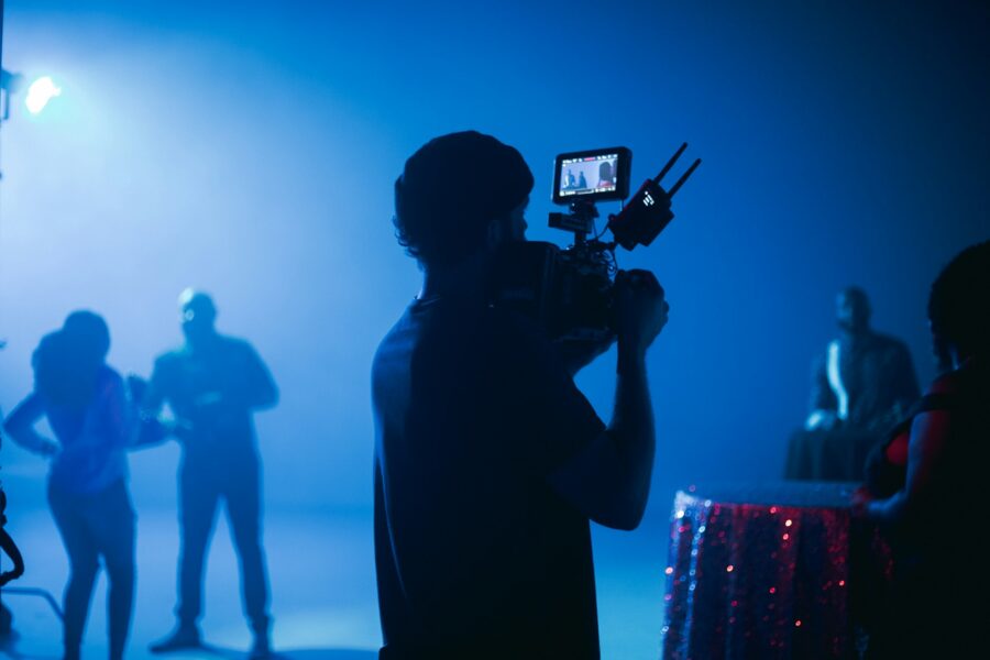 Man filming a video ad on set