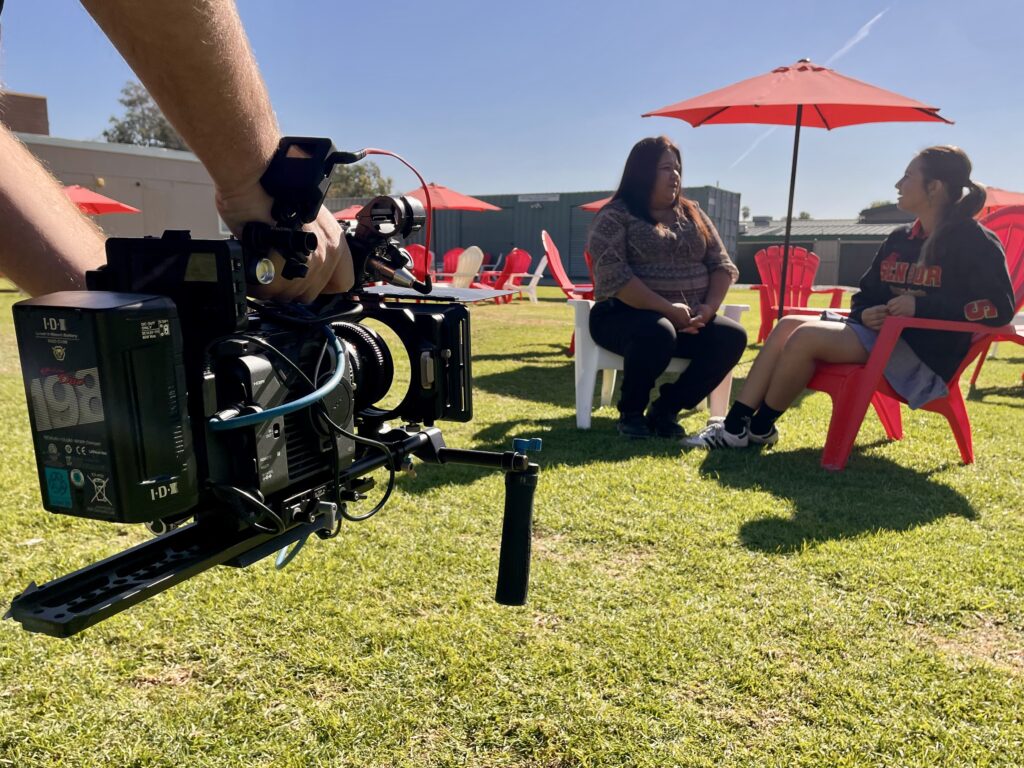 On-location video b-roll filmed by 336 Productions for an OC private school, capturing a candid outdoor conversation during a professional video shoot.